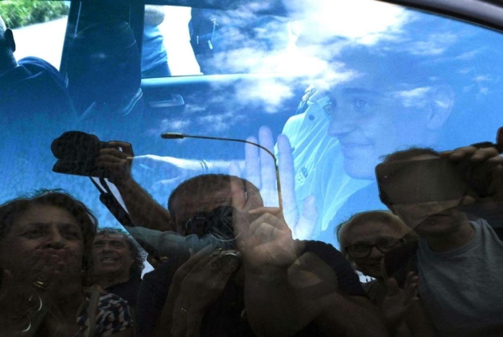 Carola Rackete alla fine dell'interrogatorio (Ansa)