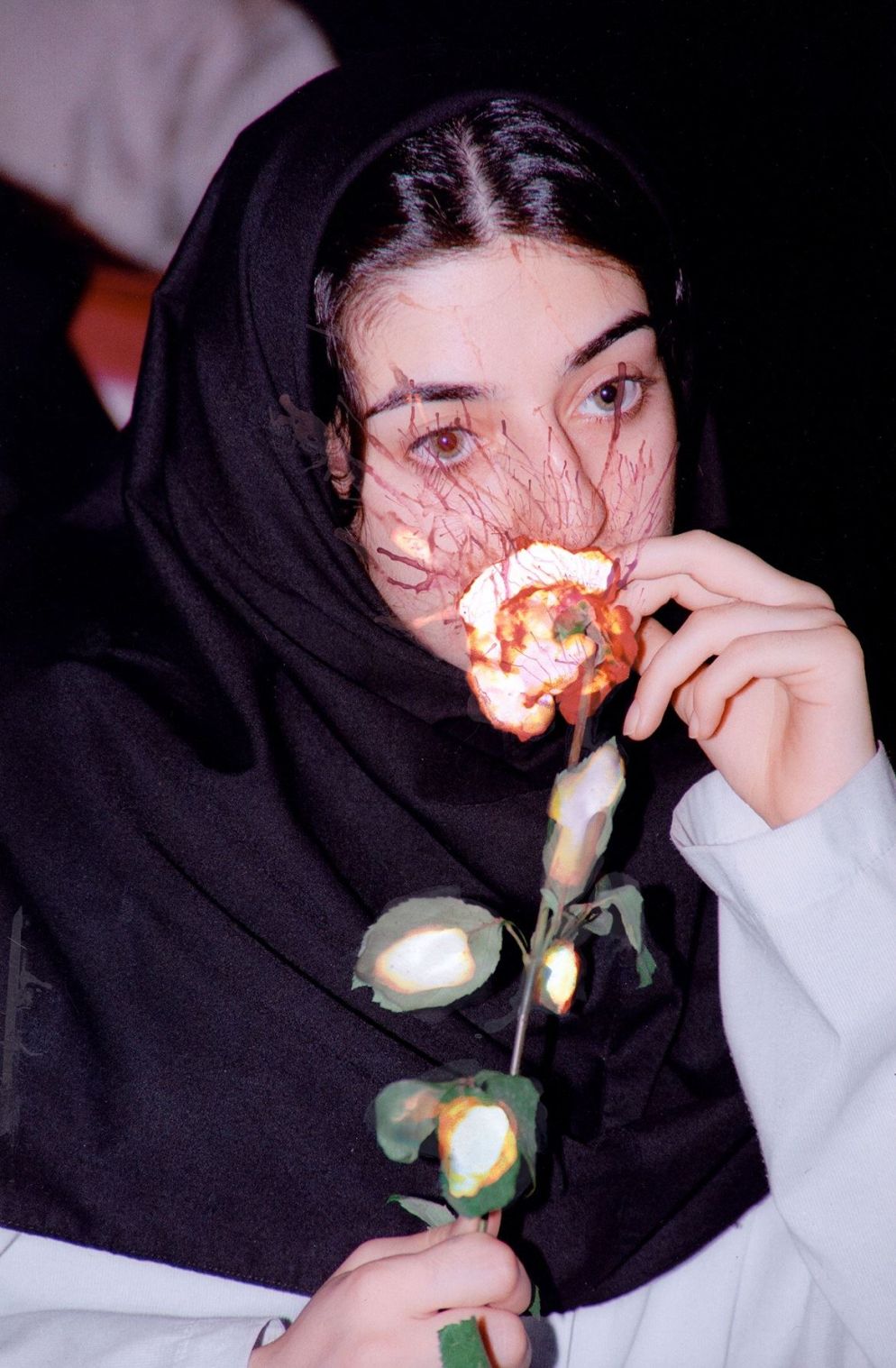 L'Iran di Newsha Tavakolian, "And They Laughed At Me" al Mudec di Milano: la ragazza che annusa una rosa - © Newsha Tavakolian